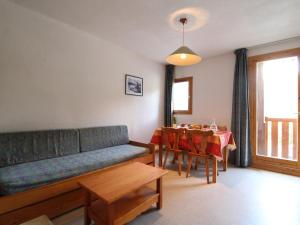a living room with a couch and a table at Appartement Termignon, 2 pièces, 4 personnes - FR-1-508-99 in Termignon