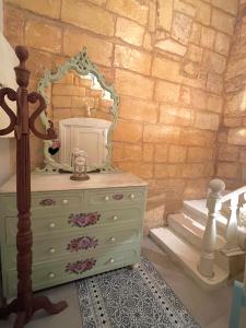 a dressing table with a mirror on top of a dresser at Moi in Birkirkara