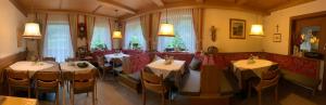 a restaurant with tables and chairs in a room at Tannerhof Bed & Breakfast in Caines +102 photos