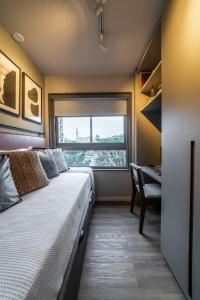 Cama ou camas em um quarto em Noon Vila Madalena