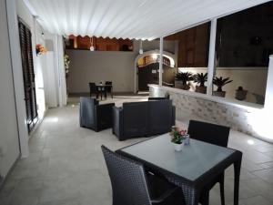 a dining room with a table and chairs at il Pascià Affittacamere in Otranto