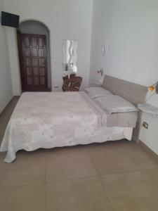 a bedroom with a large bed in a room at il Pascià Affittacamere in Otranto