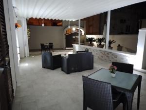 a dining room with a table and chairs in a room at il Pascià Affittacamere in Otranto +12 photos