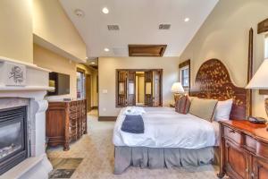 a bedroom with a large bed and a fireplace at The Chateaux Deer Valley in Park City