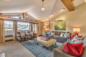 a living room filled with furniture and a large window at The Chateaux Deer Valley in Park City