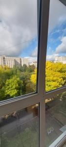 a window with a view of a city at Апартаменти Молоді LutskDoba in Lutsk