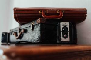 a camera sitting on a table next to a suitcase at Town Hall Inn in Lead