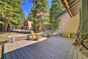 a wooden deck with benches on the side of a house at Modern Tahoe City Home Close to Beaches! in Tahoe City