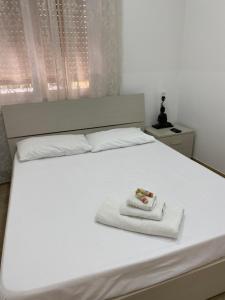 Кровать или кровати в номере Le bougainvillea 2
