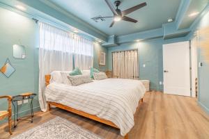 a bedroom with a bed and a ceiling fan at Stylish 2-Bedroom walking distance to Downtown in Reno