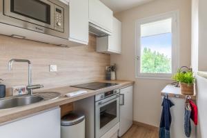 Kuchyňa alebo kuchynka v ubytovaní Appartement Fellas - Welkeys + 4 fotografie