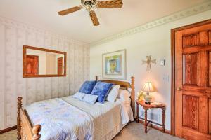 a bedroom with a bed and a ceiling fan at Charming Williamstown Retreat with Private Yard in Williamstown