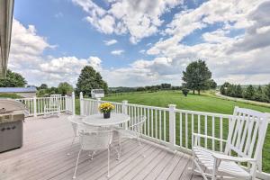 a patio with a table and chairs on a deck at Charming Williamstown Retreat with Private Yard in Williamstown