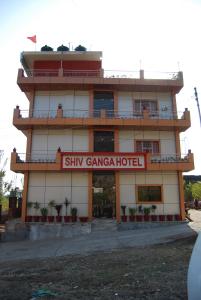 a building with a sign that reads stay gangga hotel at Hotel Shiv Ganga in Rishīkesh