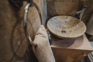 a bathroom with a sink and a counter at The Downtown Nest in Cluj-Napoca