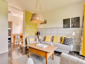 a living room with a couch and a table at Cosy holiday home with terrace in Winterberg in Winterberg