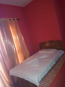 Tempat tidur dalam kamar di Hotel Meteor