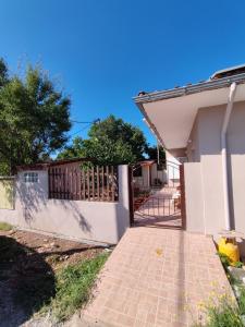 a gate to a house with a fence at kaite house in Kozani