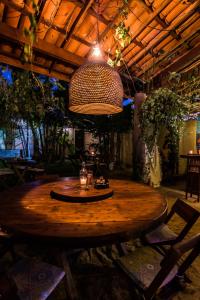a large wooden table in a room with a ceiling at Pico dos Piratas in Itarema