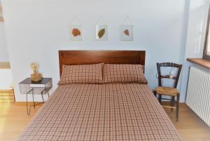 Postel nebo postele na pokoji v ubytování Cascina Villa - Casa di campagna tra le nocciole