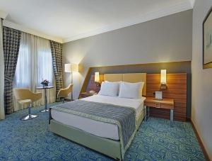 Postel nebo postele na pokoji v ubytování Spa Hotel Colossae Thermal