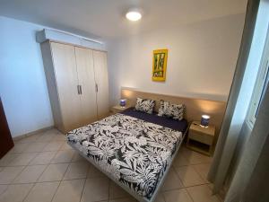 a bedroom with a bed in a room at Leme Bedje - Pool, WiFi & Beachfront in Santa Maria
