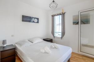 Posteľ alebo postele v izbe v ubytovaní Appartement Vanneau - Welkeys