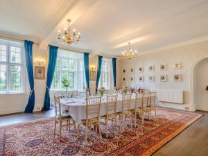 a large room with a table and chairs in it at Hodroyd Hall in Holmfirth