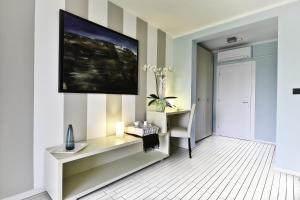 TV a/nebo společenská místnost v ubytování B&B Calligaris