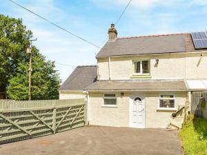 a house with a solar panel on the roof at Hengegin - Uk39874 in Llandybie