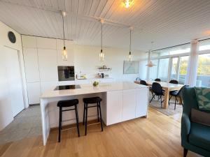 a kitchen with a large white island in a room at Cosy and spacious apartment in Reykjavik in Reykjavík