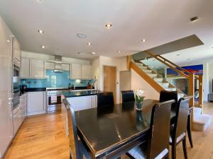 a kitchen and dining room with a table and chairs at Wellesley House in Wells