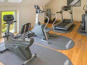 a gym with two tread machines and a treadmill at Wellesley House in Wells