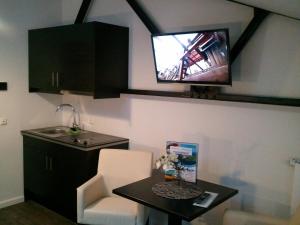 Kuchyň nebo kuchyňský kout v ubytování Heldts Aparthotel