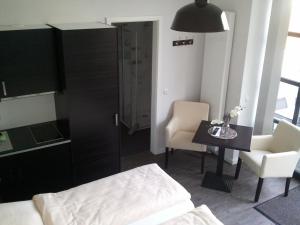 Postel nebo postele na pokoji v ubytování Heldts Aparthotel