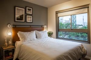 Cama ou camas em um quarto em Noon Vila Madalena