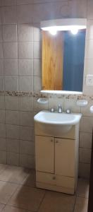 a bathroom with a sink and a mirror at monoambiente malbec ubicacion privilegiada no mascotas in Mendoza +17 photos