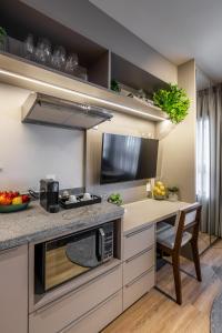 A cozinha ou cozinha compacta de Noon Vila Madalena