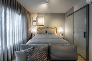 Cama ou camas em um quarto em Noon Vila Madalena