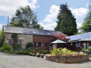 a house with a garden in front of it at Stable Cottage in Leintwardine