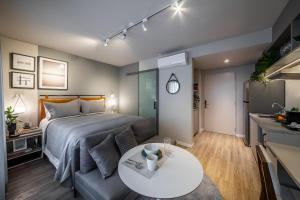 Cama ou camas em um quarto em Noon Vila Madalena