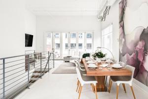 a dining room with a table and chairs at Rooftop Condo in Nashville