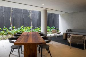 Uma área de estar em Noon Vila Madalena