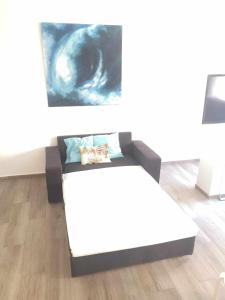 A bed or beds in a room at Loft Santa Lucia Centro