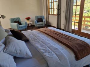 Ένα ή περισσότερα κρεβάτια σε δωμάτιο στο Wilppani Lodge