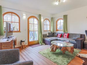 a living room with a couch and a coffee table at Salvenblick in Hopfgarten im Brixental