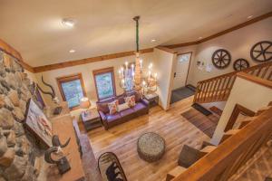 an overhead view of a living room with a stone wall at Aspencliffe Home: Perfect Mountain Getaway w/ Hot Tub in Blue River