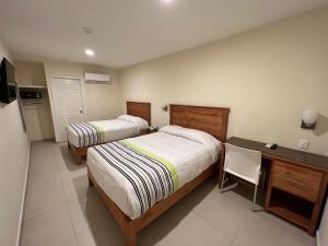 Postel nebo postele na pokoji v ubytování Hotel Baja