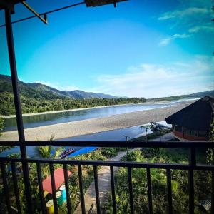 a view of the river from the balcony of a lodge at Oropendola Lodge Manu in Pillcopata