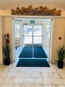 an entrance to an office with a door open at Ramada by Wyndham Anchorage in Anchorage